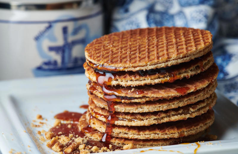 18. Stroopwafel, Netherlands 37: Baklava, various locations, 36: Rolex, Uganda, 35: Dadar gulung, Indonesia, 34: Ta'ameya, Egypt, 33: Brownies, USA, 32: Plantain chips, various locations, 31: Koeksister, South Africa, 30: Ma'amoul, Egypt, 29: Takoyaki, Japan, 28: Rice Krispie treats, USA, 27: Poffertjes, Netherlands, 26: Haggis bon bons, Scotland, 25: Pão de queijo, Brazil, 24: Chocolate digestives, UK, 23: Churros, Spain, 22: Kartoffelpuffer, Germany, 21: Stroopwafel, Netherlands, 20: Mooncake, China, 19: Sausage roll, UK, 18: Biltong, South Africa, 17: Aloo tikki, India, 16: Qatayef, Middle East, 15: Lamington, Australia, 14: S'mores, USA, 13: Meat pie, Australia and New Zealand, 12: Lumpia, Indonesia and the Philippines, 11: Nanaimo bar, Canada, 10: Pain au chocolat, France, 9: Mochi, Japan, 8: Pani puri, India, 7: Doughnut, various locations, 6: Poutine, Canada, 5: Currywurst, Germany, 4: Macaron, France, 3: Nachos, Mexico, 2: Samosa, various locations