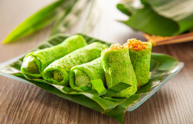 29. Dadar gulung, Indonesia 37: Baklava, various locations, 36: Rolex, Uganda, 35: Dadar gulung, Indonesia, 34: Ta'ameya, Egypt, 33: Brownies, USA, 32: Plantain chips, various locations, 31: Koeksister, South Africa, 30: Ma'amoul, Egypt, 29: Takoyaki, Japan, 28: Rice Krispie treats, USA, 27: Poffertjes, Netherlands, 26: Haggis bon bons, Scotland, 25: Pão de queijo, Brazil, 24: Chocolate digestives, UK, 23: Churros, Spain, 22: Kartoffelpuffer, Germany, 21: Stroopwafel, Netherlands, 20: Mooncake, China, 19: Sausage roll, UK, 18: Biltong, South Africa, 17: Aloo tikki, India, 16: Qatayef, Middle East, 15: Lamington, Australia, 14: S'mores, USA, 13: Meat pie, Australia and New Zealand, 12: Lumpia, Indonesia and the Philippines, 11: Nanaimo bar, Canada, 10: Pain au chocolat, France, 9: Mochi, Japan, 8: Pani puri, India, 7: Doughnut, various locations, 6: Poutine, Canada, 5: Currywurst, Germany, 4: Macaron, France, 3: Nachos, Mexico, 2: Samosa, various locations