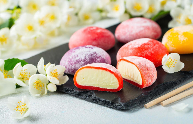 8. Mochi, Japan 37: Baklava, various locations, 36: Rolex, Uganda, 35: Dadar gulung, Indonesia, 34: Ta'ameya, Egypt, 33: Brownies, USA, 32: Plantain chips, various locations, 31: Koeksister, South Africa, 30: Ma'amoul, Egypt, 29: Takoyaki, Japan, 28: Rice Krispie treats, USA, 27: Poffertjes, Netherlands, 26: Haggis bon bons, Scotland, 25: Pão de queijo, Brazil, 24: Chocolate digestives, UK, 23: Churros, Spain, 22: Kartoffelpuffer, Germany, 21: Stroopwafel, Netherlands, 20: Mooncake, China, 19: Sausage roll, UK, 18: Biltong, South Africa, 17: Aloo tikki, India, 16: Qatayef, Middle East, 15: Lamington, Australia, 14: S'mores, USA, 13: Meat pie, Australia and New Zealand, 12: Lumpia, Indonesia and the Philippines, 11: Nanaimo bar, Canada, 10: Pain au chocolat, France, 9: Mochi, Japan, 8: Pani puri, India, 7: Doughnut, various locations, 6: Poutine, Canada, 5: Currywurst, Germany, 4: Macaron, France, 3: Nachos, Mexico, 2: Samosa, various locations