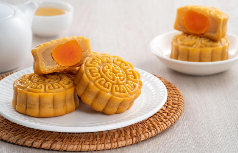 17. Mooncake, China 37: Baklava, various locations, 36: Rolex, Uganda, 35: Dadar gulung, Indonesia, 34: Ta'ameya, Egypt, 33: Brownies, USA, 32: Plantain chips, various locations, 31: Koeksister, South Africa, 30: Ma'amoul, Egypt, 29: Takoyaki, Japan, 28: Rice Krispie treats, USA, 27: Poffertjes, Netherlands, 26: Haggis bon bons, Scotland, 25: Pão de queijo, Brazil, 24: Chocolate digestives, UK, 23: Churros, Spain, 22: Kartoffelpuffer, Germany, 21: Stroopwafel, Netherlands, 20: Mooncake, China, 19: Sausage roll, UK, 18: Biltong, South Africa, 17: Aloo tikki, India, 16: Qatayef, Middle East, 15: Lamington, Australia, 14: S'mores, USA, 13: Meat pie, Australia and New Zealand, 12: Lumpia, Indonesia and the Philippines, 11: Nanaimo bar, Canada, 10: Pain au chocolat, France, 9: Mochi, Japan, 8: Pani puri, India, 7: Doughnut, various locations, 6: Poutine, Canada, 5: Currywurst, Germany, 4: Macaron, France, 3: Nachos, Mexico, 2: Samosa, various locations