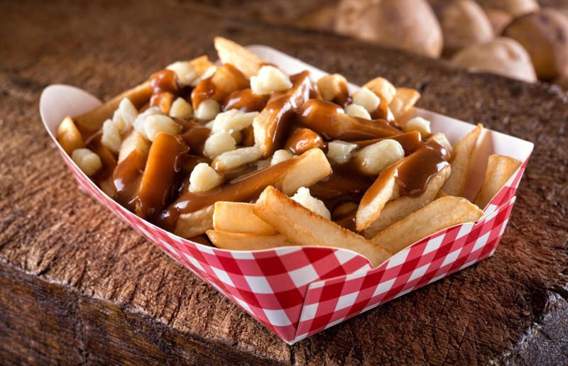 5. Poutine, Canada 37: Baklava, various locations, 36: Rolex, Uganda, 35: Dadar gulung, Indonesia, 34: Ta'ameya, Egypt, 33: Brownies, USA, 32: Plantain chips, various locations, 31: Koeksister, South Africa, 30: Ma'amoul, Egypt, 29: Takoyaki, Japan, 28: Rice Krispie treats, USA, 27: Poffertjes, Netherlands, 26: Haggis bon bons, Scotland, 25: Pão de queijo, Brazil, 24: Chocolate digestives, UK, 23: Churros, Spain, 22: Kartoffelpuffer, Germany, 21: Stroopwafel, Netherlands, 20: Mooncake, China, 19: Sausage roll, UK, 18: Biltong, South Africa, 17: Aloo tikki, India, 16: Qatayef, Middle East, 15: Lamington, Australia, 14: S'mores, USA, 13: Meat pie, Australia and New Zealand, 12: Lumpia, Indonesia and the Philippines, 11: Nanaimo bar, Canada, 10: Pain au chocolat, France, 9: Mochi, Japan, 8: Pani puri, India, 7: Doughnut, various locations, 6: Poutine, Canada, 5: Currywurst, Germany, 4: Macaron, France, 3: Nachos, Mexico, 2: Samosa, various locations