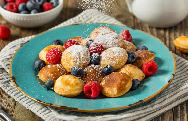 23. Poffertjes, Netherlands 37: Baklava, various locations, 36: Rolex, Uganda, 35: Dadar gulung, Indonesia, 34: Ta'ameya, Egypt, 33: Brownies, USA, 32: Plantain chips, various locations, 31: Koeksister, South Africa, 30: Ma'amoul, Egypt, 29: Takoyaki, Japan, 28: Rice Krispie treats, USA, 27: Poffertjes, Netherlands, 26: Haggis bon bons, Scotland, 25: Pão de queijo, Brazil, 24: Chocolate digestives, UK, 23: Churros, Spain, 22: Kartoffelpuffer, Germany, 21: Stroopwafel, Netherlands, 20: Mooncake, China, 19: Sausage roll, UK, 18: Biltong, South Africa, 17: Aloo tikki, India, 16: Qatayef, Middle East, 15: Lamington, Australia, 14: S'mores, USA, 13: Meat pie, Australia and New Zealand, 12: Lumpia, Indonesia and the Philippines, 11: Nanaimo bar, Canada, 10: Pain au chocolat, France, 9: Mochi, Japan, 8: Pani puri, India, 7: Doughnut, various locations, 6: Poutine, Canada, 5: Currywurst, Germany, 4: Macaron, France, 3: Nachos, Mexico, 2: Samosa, various locations
