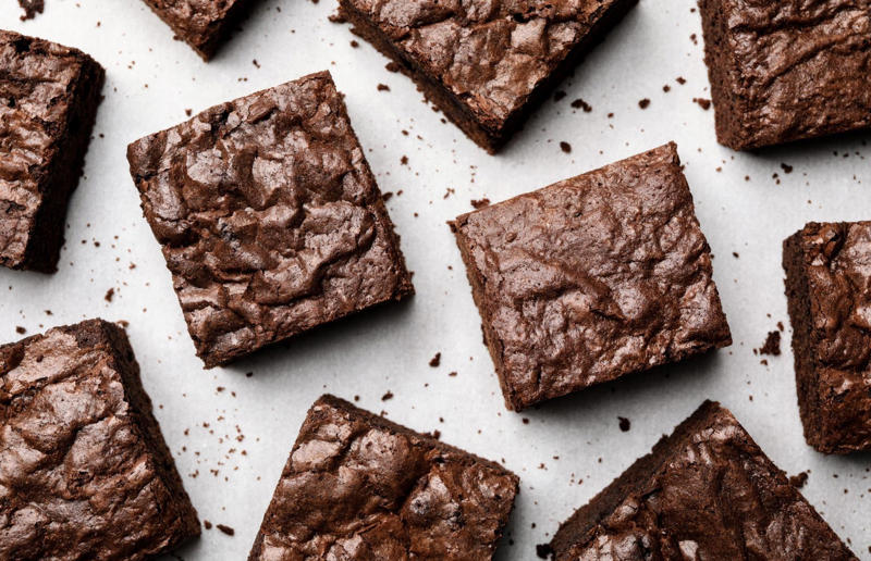 12. Brownies, USA 37: Baklava, various locations, 36: Rolex, Uganda, 35: Dadar gulung, Indonesia, 34: Ta'ameya, Egypt, 33: Brownies, USA, 32: Plantain chips, various locations, 31: Koeksister, South Africa, 30: Ma'amoul, Egypt, 29: Takoyaki, Japan, 28: Rice Krispie treats, USA, 27: Poffertjes, Netherlands, 26: Haggis bon bons, Scotland, 25: Pão de queijo, Brazil, 24: Chocolate digestives, UK, 23: Churros, Spain, 22: Kartoffelpuffer, Germany, 21: Stroopwafel, Netherlands, 20: Mooncake, China, 19: Sausage roll, UK, 18: Biltong, South Africa, 17: Aloo tikki, India, 16: Qatayef, Middle East, 15: Lamington, Australia, 14: S'mores, USA, 13: Meat pie, Australia and New Zealand, 12: Lumpia, Indonesia and the Philippines, 11: Nanaimo bar, Canada, 10: Pain au chocolat, France, 9: Mochi, Japan, 8: Pani puri, India, 7: Doughnut, various locations, 6: Poutine, Canada, 5: Currywurst, Germany, 4: Macaron, France, 3: Nachos, Mexico, 2: Samosa, various locations