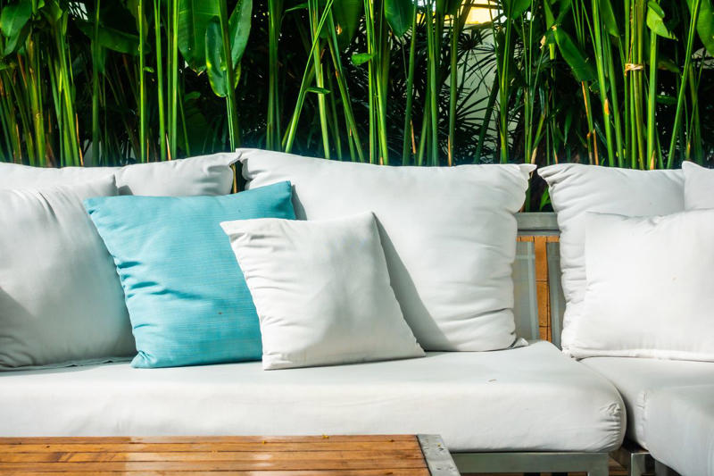 What You'll Need , How to Clean Patio Cushions, How to Clean Outdoor Cushions with Non-Removable Covers , How to Clean Patio Cushions with Baking Soda or Vinegar, How to Remove Stains on Outdoor Cushions and Pillows, How to Maintain Outdoor Pillows and Cushions