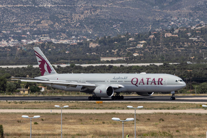 Qatar Airways Boeing 777-300ER passenger airplane as seen on final approach flying, landing and taxiing at Athens International Airport ATH in the Greek capital. Aer Lingus, Air Baltic, Air Busan, Air France, Air New Zealand, Air Seoul, British Airways, Emirates, FlyDubai, Korean Air, Qatar Airways