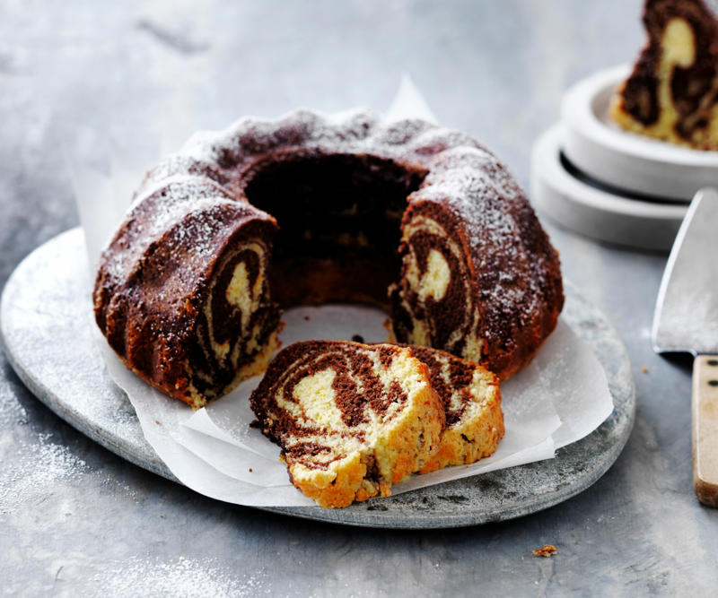 Popular orange varieties for these recipes, Orange recipes to try, Julie Goodwin’s orange almond cake , Flourless orange & white chocolate cake , Double-crumbed pork cotoletta with radicchio & orange salad , Whole orange slice , Orange and blueberry syrup cake , Sugar-free rosemary, labne and orange tart , Hummingbird slice with orange icing , Dark chocolate and orange Christmas slice , Cherry coconut and orange cake , Sweet pea, cinnamon and orange cake , Confit duck & candied orange salad , Chocolate parfait with orange salad , Beetroot and orange salad , Pan-fried fish with radicchio and orange salad , Blood-orange glazed ham , Blood orange hazelnut cake , How to make a chocolate orange ‘tiger’ bundt cake , Green salad with red currants & orange dressing , Orange, poppy seed & olive oil mug cake , Maple, mustard and orange glazed ham , How to choose the best oranges for these recipes, How to remove wax from oranges, Should oranges be stored in or out of the fridge?, How to segment an orange