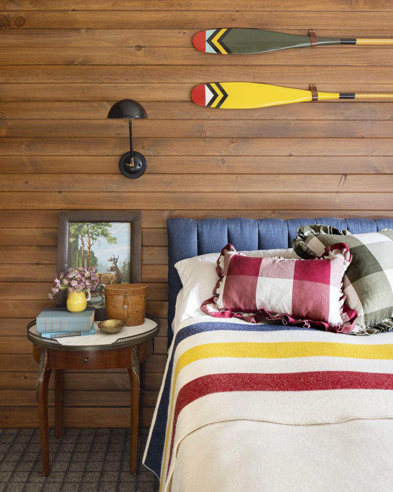 ADIRONDACK FRAMES, VINTAGE LUGGAGE, CRAFT STICK LAMPS, TWIN BEDS (OF COURSE), LEAF MOTIFS, TWO-SEATER TABLES, BANDANA BUNTING, CRISP GREEN PAINT, CANOE PADDLES , PICTURES &amp; POSTCARDS
