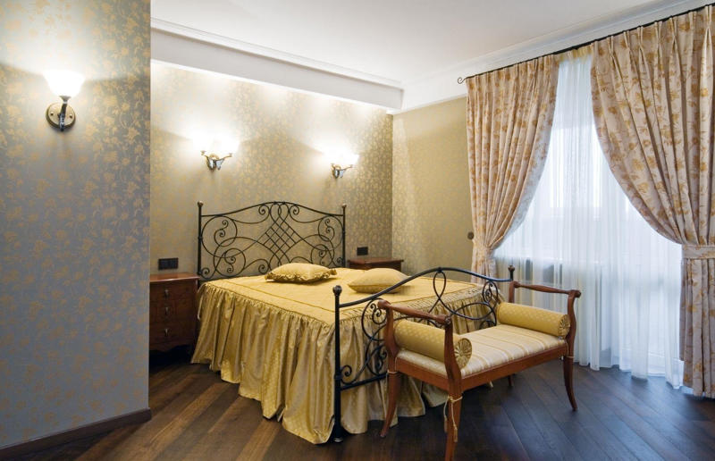 Then: metal frame beds These interior design trends are back with a bang, Then: wall sconces, Then: metal frame beds, Then: dried flowers, Then: checkerboard flooring, Now: checkerboard flooring, Then: textured surfaces, Then: pink bathrooms, Then: Art Deco style, Then: 70s palettes, Then: sink skirts, Then: corner sofas, Then: exposed brick, Then: fringing, Now: fringing, Then: primary colours, Now: primary colours, Then: wicker furniture, Then: dark kitchens, Then: wood cladding, Then: colourful kitchen appliances, Now: colourful kitchen appliances, Then: succulents and cacti, Now: succulents and cacti, Then: square tiles, Then: macrame, Now: macrame, Then: decorative tiles, Then: vinyl record players, Now: vinyl record players, Then: blousy florals, Then: pink kitchens, Then: maximalism, Then: gingham