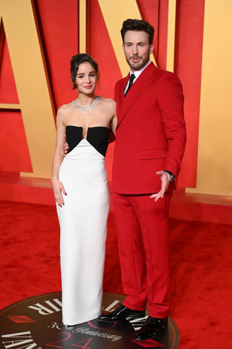 Alba Baptista is a 28-year-old Portuguese actress., She and Chris Evans were first rumored to be dating in 2021., Evans and Baptista had two weddings in 2023., The pair welcomed their first child, daughter Alma, in October 2025., Evans shared his biggest tribute to Baptista on Valentine’s Day 2023., Evans first spoke about Baptista in a September 2023 GQ interview., Friends made rare comments about their relationship in March 2025., Evans opened up about his proposal to Baptista in June 2025.