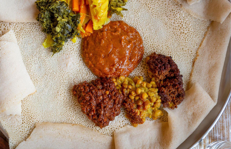 30. Injera, Eritrea and Ethiopia 33. Mielie bread, South Africa, 32. Grissini, Italy, 31. Arepa, Colombia and Venezuela, 30. Injera, Eritrea and Ethiopia, 29. Knäckebröd, Sweden, 28. Rēwena bread, New Zealand, 27. Brioche, France, 26. Khameer flatbread, UAE, 25. Damper, Australia, 24. Bannock, Canada, 23. Pumpernickel, Germany, 22. Pane carasau, Italy, 21. Broa, Portugal, 20. Korovai, Ukraine, 19. Obwarzanek Krakowski, Poland, 18. Paratha, India, 17. Focaccia, Italy, 16. Manakeesh, Middle East, 15. Submarine roll, USA, 14. Pupusa, El Salvador, 13. Soda bread, Ireland, 12. Pretzel, Germany, 11. Challah, Israel, 10. Shokupan, Japan, 9. English Muffin, England, UK, 8. Chapati, India, 7. Pitta, Greece, Middle East, 6. Mantou, China, 5. Bagel, Canada, Poland, and USA, 4. Tortilla, Mexico, 3. Ciabatta, Italy, 2. Naan, India