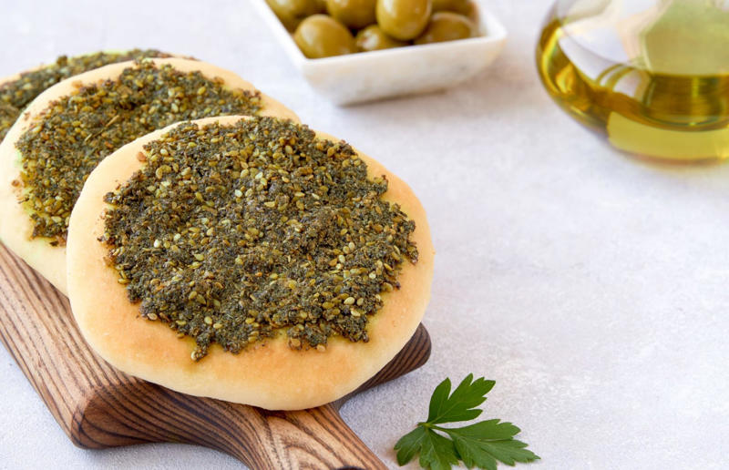 16. Manakeesh, Middle East 33. Mielie bread, South Africa, 32. Grissini, Italy, 31. Arepa, Colombia and Venezuela, 30. Injera, Eritrea and Ethiopia, 29. Knäckebröd, Sweden, 28. Rēwena bread, New Zealand, 27. Brioche, France, 26. Khameer flatbread, UAE, 25. Damper, Australia, 24. Bannock, Canada, 23. Pumpernickel, Germany, 22. Pane carasau, Italy, 21. Broa, Portugal, 20. Korovai, Ukraine, 19. Obwarzanek Krakowski, Poland, 18. Paratha, India, 17. Focaccia, Italy, 16. Manakeesh, Middle East, 15. Submarine roll, USA, 14. Pupusa, El Salvador, 13. Soda bread, Ireland, 12. Pretzel, Germany, 11. Challah, Israel, 10. Shokupan, Japan, 9. English Muffin, England, UK, 8. Chapati, India, 7. Pitta, Greece, Middle East, 6. Mantou, China, 5. Bagel, Canada, Poland, and USA, 4. Tortilla, Mexico, 3. Ciabatta, Italy, 2. Naan, India