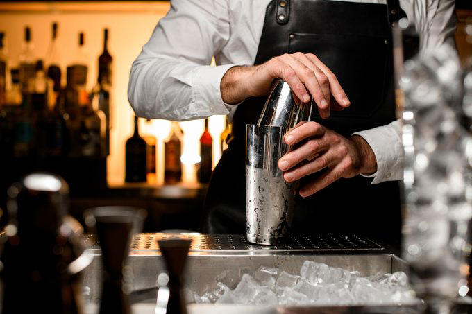 The dos and don’ts of bar etiquette, Asking them to do a shot with you, Picking up your drink before they give it to you, Cleaning up broken glass, Itemizing and splitting a tab, Stuffing napkins, straw wrappers or other trash into your cup, Telling them your life story, Asking them out, Reaching over or behind the bar to grab something quickly, Buying a round of drinks, Asking them to “surprise you” with a drink, Requesting a custom cocktail or ordering off-menu, Using beverage napkins to clean up a spill, Handing them a wad of cash, Getting creative with the tip, Not bothering them with safety concerns, Keeping things simple without a menu, About the experts, Why trust us