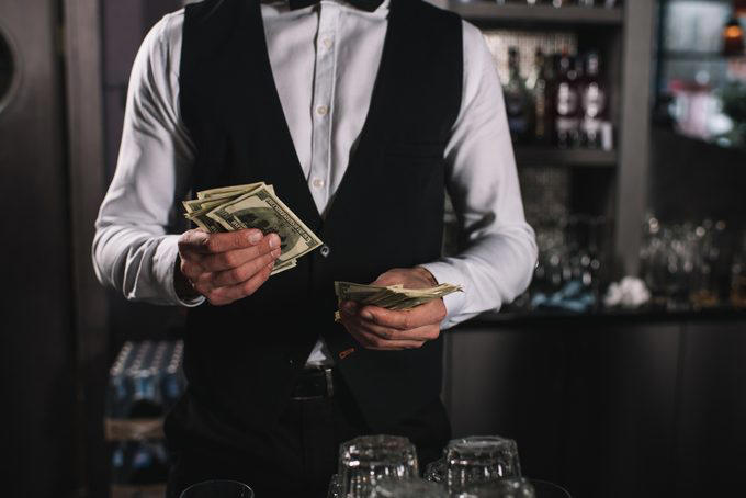 The dos and don’ts of bar etiquette, Asking them to do a shot with you, Picking up your drink before they give it to you, Cleaning up broken glass, Itemizing and splitting a tab, Stuffing napkins, straw wrappers or other trash into your cup, Telling them your life story, Asking them out, Reaching over or behind the bar to grab something quickly, Buying a round of drinks, Asking them to “surprise you” with a drink, Requesting a custom cocktail or ordering off-menu, Using beverage napkins to clean up a spill, Handing them a wad of cash, Getting creative with the tip, Not bothering them with safety concerns, Keeping things simple without a menu, About the experts, Why trust us