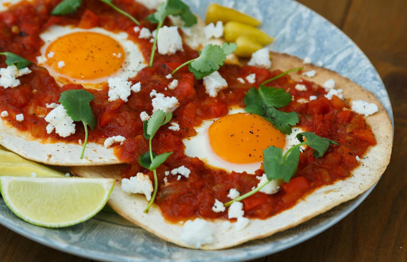 Huevos rancheros Speedy suppers, Homemade pitta nachos with crispy lamb and salad, Sticky honey and ginger chicken, Fish finger sandwich, Butternut squash and feta pizza, Speedy chicken broth, Teriyaki steak and asparagus, Huevos rancheros, Prawn, chorizo and basil linguine, Cheese, ham and fig crêpes, Steak with peppercorn sauce, Caesar salad, Mussels rassa, Cheeseburgers, Grilled king prawns with chermoula, Loaded jacket potatoes, Easy macaroni cheese, Lamb and chorizo burger, Apple and turkey quesadillas, Spiced beef skewers, Yakisoba, Thai spiced fish cakes, Chinese crispy pork, Falafel sandwich, Prawn tacos, Grilled vegetable salad, Crab spaghetti, Potato, courgette and goats’ cheese frittata, Haddock in cheese sauce, Sausages with cannellini mash, Croque madame