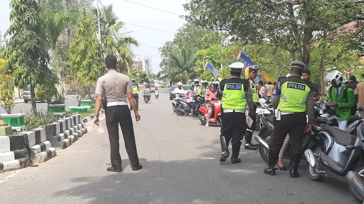 polisi, razia, razia besar-besaran, korlantas polri, Tarik Rem Dadakan, Korlantas Polri Tunda Operasi Patuh 2026 Karena Ini