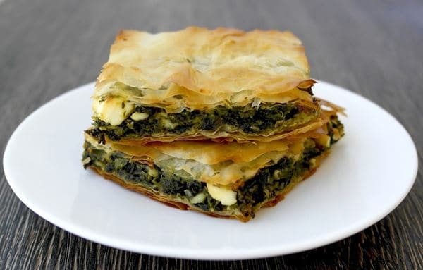 Spanakopita, 1. Moussaka, 2. Fasolatha, 3. Roti Pita, 4. Souvlaki, 5. Spanakopita, 6. Koulouri, 7. Greek Seafood, 8. Greek Burito, 9. Keju Feta, 10. Portokalopita
