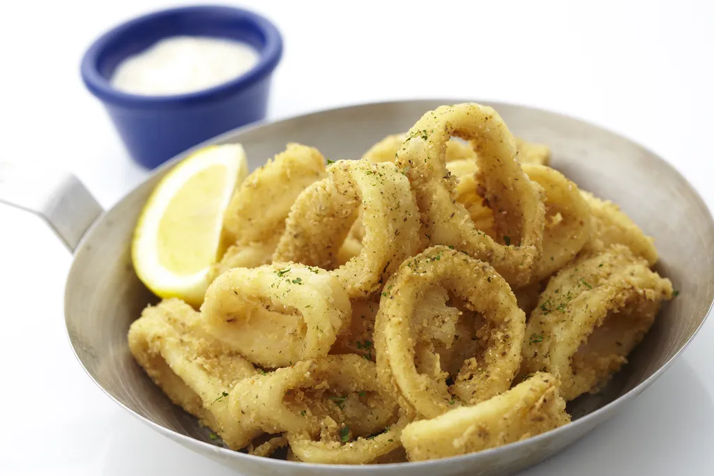 Fried Calamari, 1. Fish & Chips, 2. Seafood Platter, 3. Fried Calamari, 4. Paella Rice with Grilled Chicken Peri-Peri Sauce, 5. Pasta, 6. Salmon Cajun with Lemon Butter Sauce, 7. Crispy Fish Skin, 8. Grilled Corn with Garlic Butter, 9. Caesar Salad