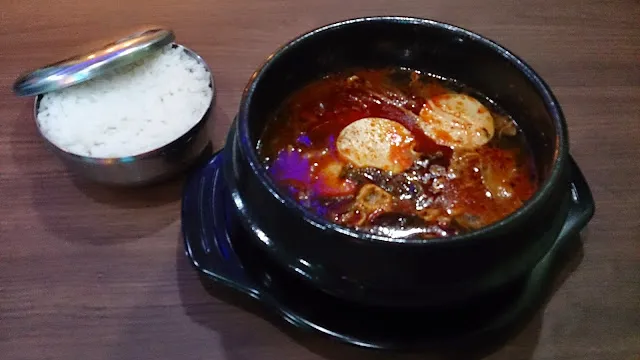 sundubu jjigae_, 1. Original Patbingsoo, 2. Mandu Guksu, 3. Jumukbap, 4. Bibimbap, 5. Chijeu (Cheese) Bokkeumbap, 6. Teokbbokki, 7. Hotteok, 8. Spicy Chicken Popcorn, 9. Yangnyeom Tongdak, 10. Ramyeon, 11. Jjajangmyeon, 12. Gun Mandu, 13. Sundubu Jjigae, 14. Oksusucha, 15. Korean Milk Tea