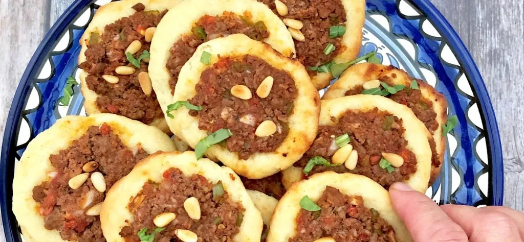 Sfiha, 1. Maqluba, 2. Musakhan, 3. Sumaghiyyeh, 4. Mujadara, 5. Qidreh, 6. Maftoul, 7. Fatayer, 8. Sfiha, 9. Taboon Bread, 10. Kanafeh