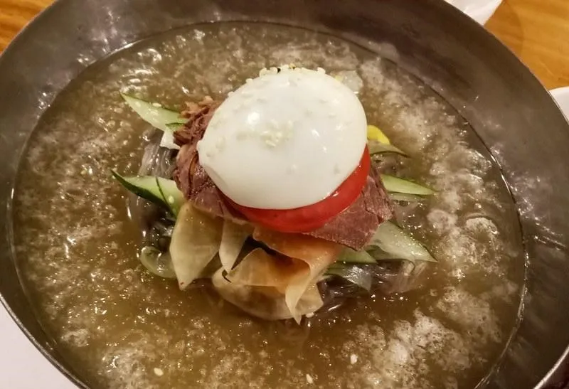 Naengmyeon, 1. Samgyeopsal, 2. Kimchi Jiggae, 3. Makgeolli, 4. Galbi Yukgaejang, 5. Honey Chicken, 6. Haemul Pajeon , 7. Naengmyeon, 8. Bibimbap, 9. Yangnyeom Chicken, 10. Bulgogi Gui