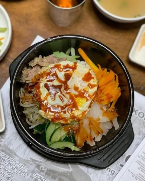 Bibimbap, 1. Samgyeopsal, 2. Kimchi Jiggae, 3. Makgeolli, 4. Galbi Yukgaejang, 5. Honey Chicken, 6. Haemul Pajeon , 7. Naengmyeon, 8. Bibimbap, 9. Yangnyeom Chicken, 10. Bulgogi Gui