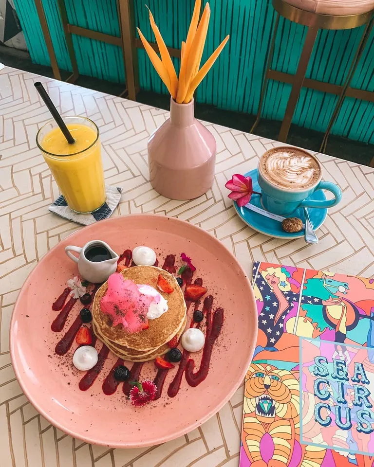 Fairy Floss Pancakes, 1. Fairy Floss Pancakes, 2. Quinoa, Feta &amp; Avo Salad, 3. Egg Benedict, 4. Chicken Taco, 5. Scrambled Tofu, 6. Summer Poke Bowl, 7. Burger, 8. Jamaican Spiced Chicken, 9. Hot Churros, 10. Paket Hangover Meal