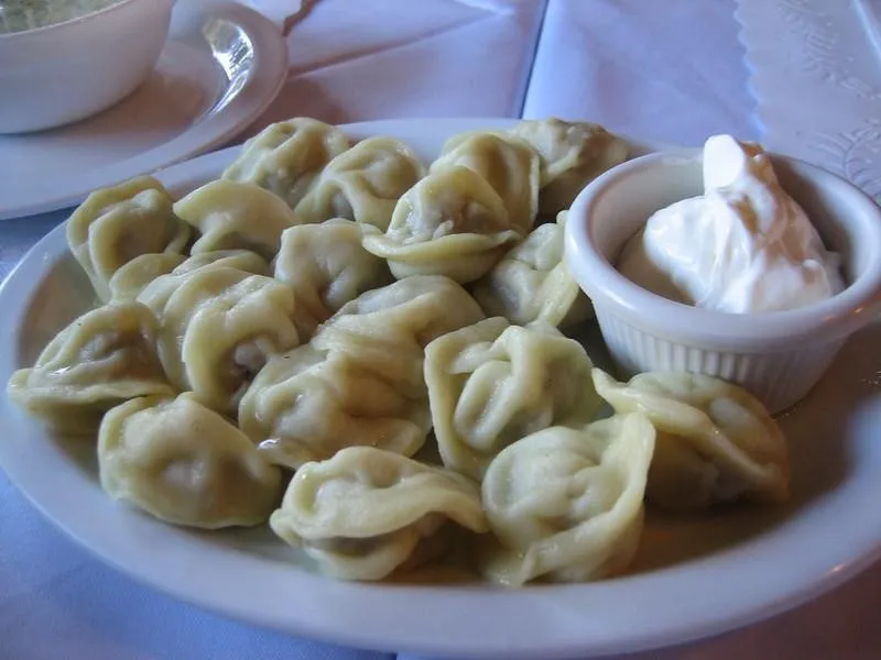 Pelmeni, 1. Borscht, 2. Pelmeni, 3. Blini, 4. Pirozhki, 5. Shashlik, 6. Kholodets, 7. Oladyi, 8. Solyanka, 9. Okroshka, 10. Beef Stroganoff