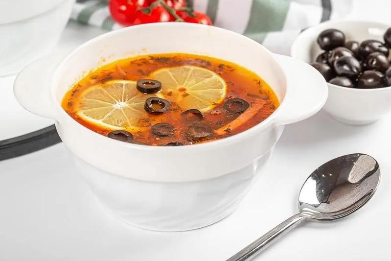 Solyanka, 1. Borscht, 2. Pelmeni, 3. Blini, 4. Pirozhki, 5. Shashlik, 6. Kholodets, 7. Oladyi, 8. Solyanka, 9. Okroshka, 10. Beef Stroganoff