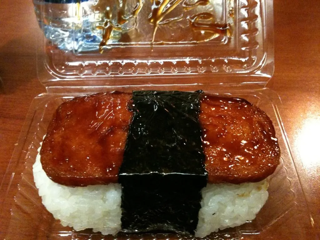 Spam Musubi, 3. Kalua Pork, 4. Lau Lau, 5. Spam Musubi, 6. Saimin, 7. Loco moco, 8. Lomi lomi salmon, 9. Manapua, 10. Chicken long rice 