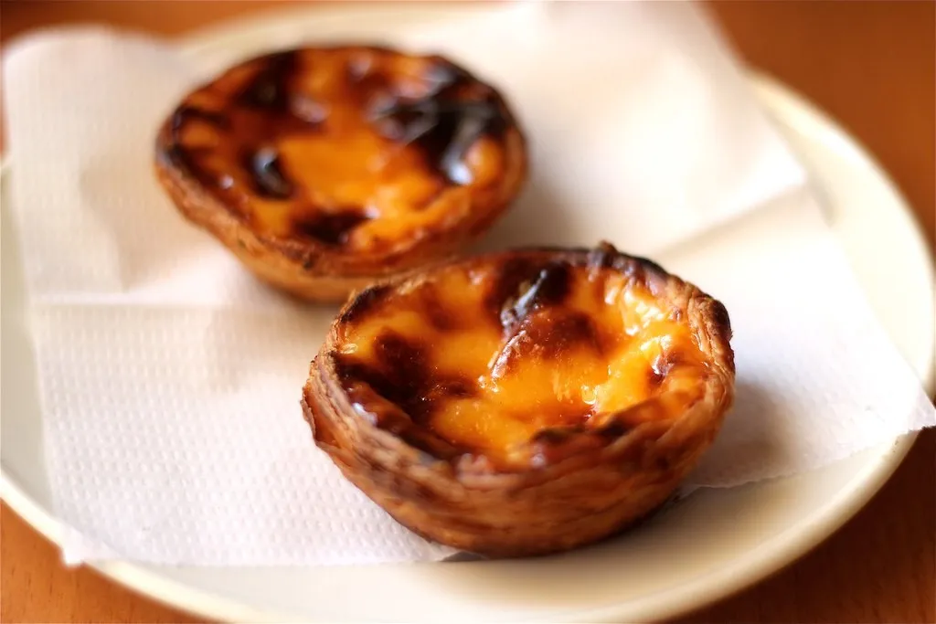 Pastéis de Nata, 1. Po de Deus, 2. Pastéis de Nata, 3. Bolo Rei, 4. Po de ló, 5. Queijada, 6. Tibias de Braga, 7. Papos de Anjo, 8. Baba de Camelo, 9. Bolas de Berlim, 10. Travesseiros de Sintra