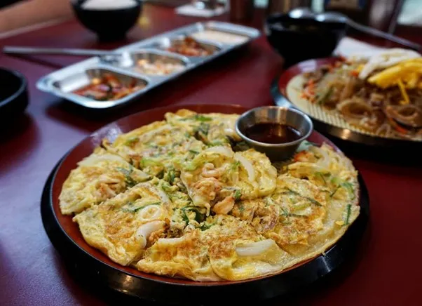 Seafood Pajeon, 1. Beef Rib Rolling Cheese, 2. Rolling Cheese Chicken Wings, 3. Budae Jjigae, 4. Cheese Fondue, 5. Seafood Pajeon, 6. Corn Tea, 7. Martabak Bingsoo, 8. Gyeran Jjim, 9. Japchae, 10. Cheesy Smoked Beef