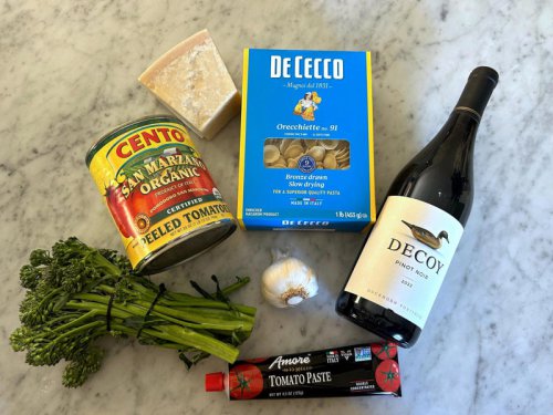 Ina Garten's orecchiette pasta features two types of sausage and broccoli rabe., First, I preheated the oven to 350 degrees Fahrenheit and prepped the sausages., While my sausages were cooking, I added the olive oil to my Dutch oven., I took my sausages out of the oven, sliced each link into &frac12;-inch pieces, and threw them into the pot., After cooking the sausages for five minutes, I added the garlic., Then, it was time to add the tomatoes and wine., I turned the heat to low so the sauce could simmer while I prepped my pasta., I filled a large pot with water and placed it over the stove, bringing it to a boil before adding the pasta., I set a timer for exactly nine minutes and prepped the broccoli as my pasta cooked., As the pasta and broccoli cooked together, I tried to snap a picture &mdash; and accidentally dropped my phone into the boiling hot water., The show had to go on, so I drained the pasta and broccoli rabe in a colander., Then, I added the pasta and broccoli to the pot with the sausage and tomato sauce., I tried Ina Garten's easy one-pot sausage pasta. The delicious dish tasted even better the next day