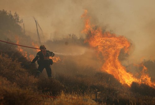 Greece shuts Acropolis and tells outdoor workers to down tools as country scorches in extreme heatwave