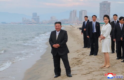 Kim Jong Un watches swimmers use waterslide as North Korea opens huge beach resort to boost tourism