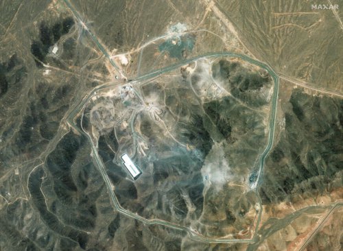 Satellite images appear to show excavators and bulldozers at work at Iran's bombed-out nuclear site