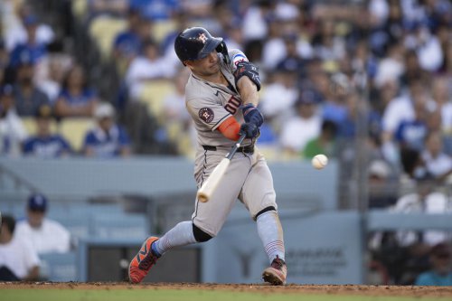 Astros' Altuve homers twice, drives in five and gets booed in 18-1 historic rout of Dodgers