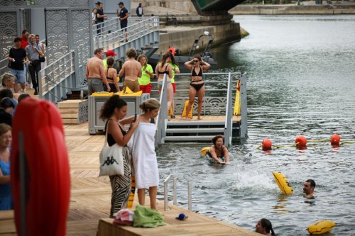 Swimmers plunge into the river Seine after 100-year ban lifts