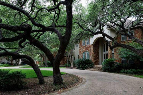 Soaring atrium, graceful catwalk, large windows make Shavano Park home one-of-a-kind