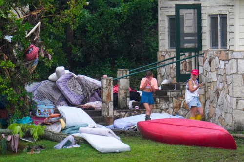 Race on to rescue 11 campers still missing in floods
