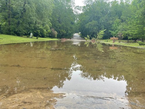 &lsquo;I never experienced that kind of rain here, ever&rsquo;: Low-water bridge overflows into Lenexa neighborhood