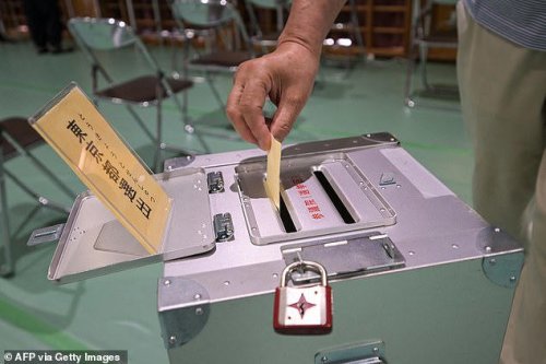 Japan's Prime Minister vows not to quit despite 'harsh result' on polls