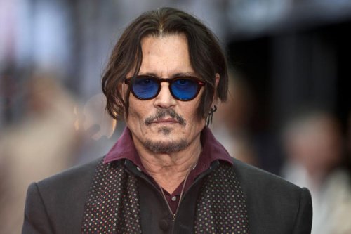 Johnny Depp Smiles on Red Carpet at London Premiere of &ldquo;Modi&rdquo;, the First Film He's Directed in Over 20 Years