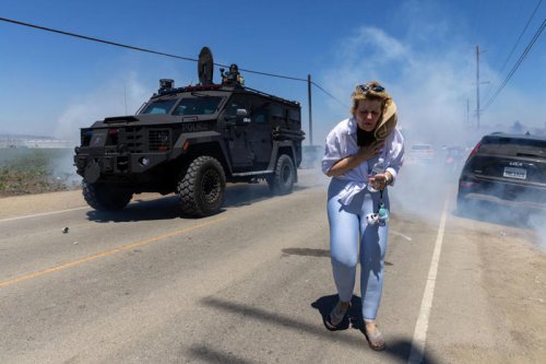Federal agents and protesters clash at major immigration raid at California farm