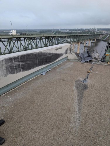 Truck smashes through barrier and plunges off a bridge into the Delaware River