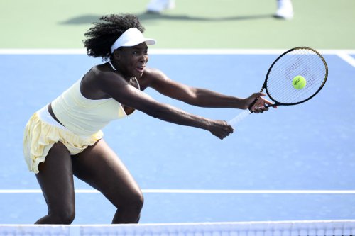Venus Williams wins a doubles match at Washington in her first tournament in more than a year