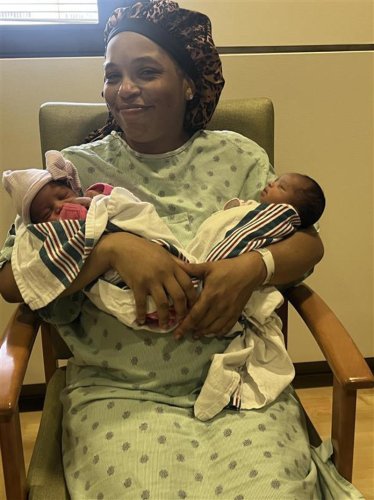 Detroit EMTs reunite with twin girls delivered during emergency home birth