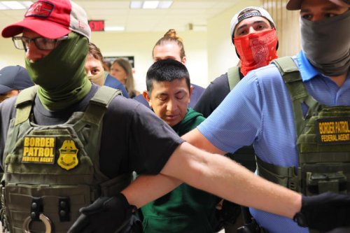 Safety measure? Or intimidation tactic? Masked ICE agents spark the debate