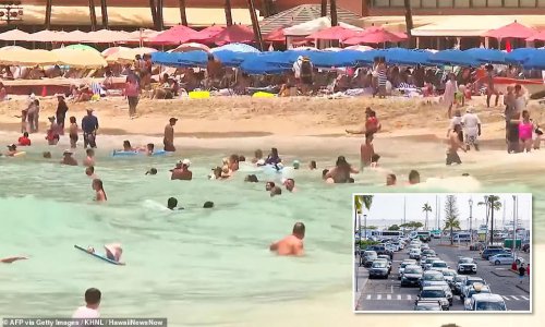 Swimmers ignore tsunami warning on Hawaii's Waikiki Beach