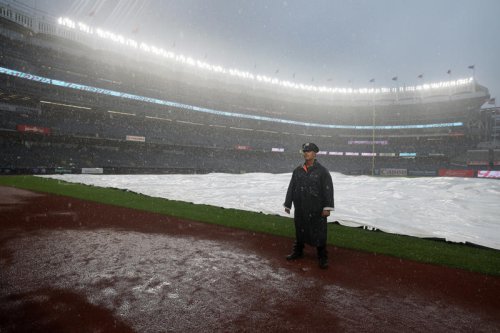 Torrential Northeast rain floods streets, strands New York City train passengers