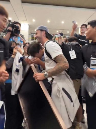 Moment South Korean Tottenham fan bursts into tears after meeting James Maddison